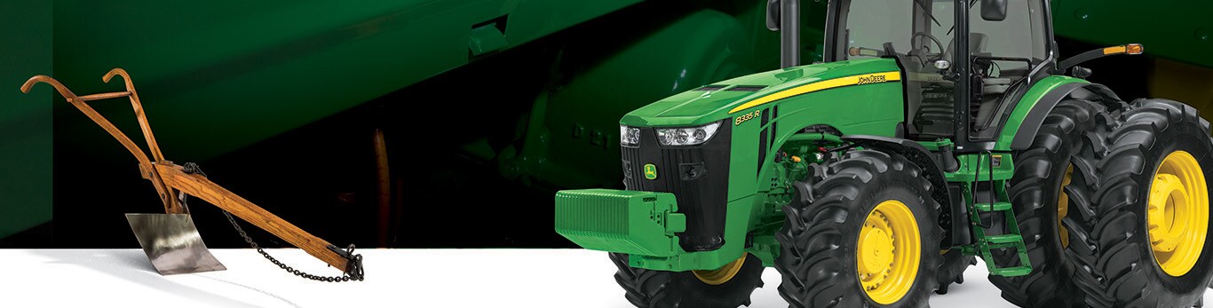 John Deere-ის თანამედროვე ტრაქტორისა და ორიგინალური ფოლადის სათიბის გამოსახულებები